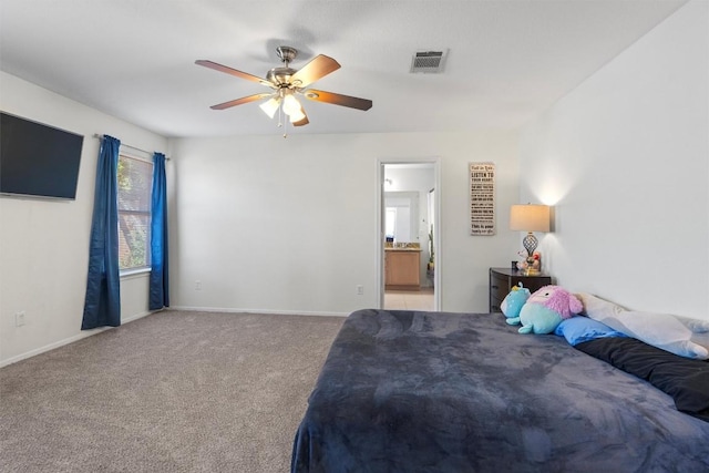 6005 La Mesa St, Leander, TX 78645 - bedroom with carpet flooring, connected bathroom, and a ceiling fan