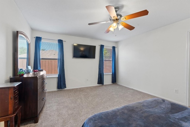 6005 La Mesa St, Leander, TX 78645 - bedroom with light carpet, multiple windows, and a ceiling fan