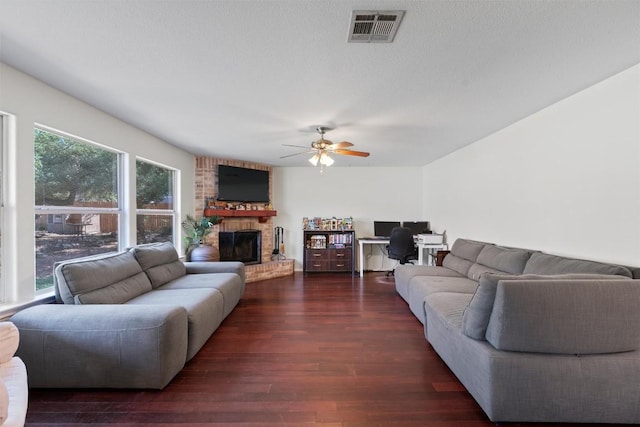 6005 La Mesa St, Leander, TX 78645 - living area featuring ceiling fan, a fireplace, an office area, and wood finished floors