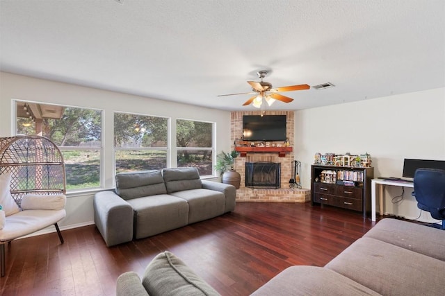 6005 La Mesa St, Leander, TX 78645 - living area with a fireplace, a ceiling fan, and wood finished floors