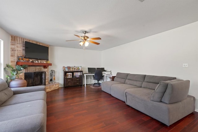 6005 La Mesa St, Leander, TX 78645 - living room with a desk, ceiling fan, wood finished floors, and a fireplace