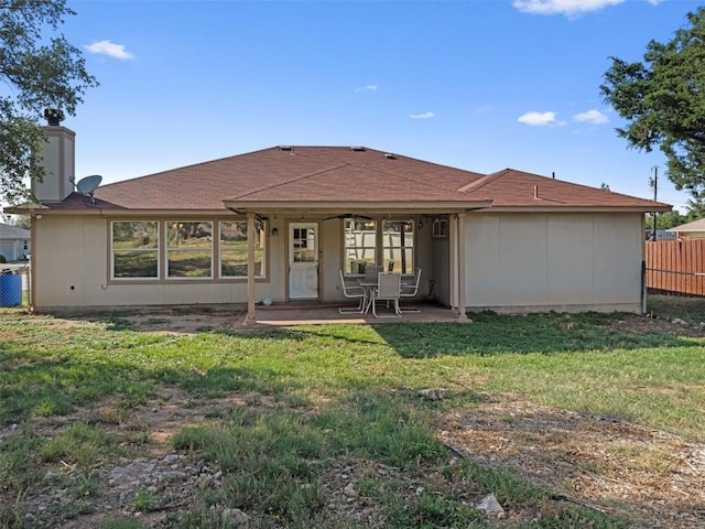 6005 La Mesa St, Leander, TX 78645 - back of house with a patio and a chimney