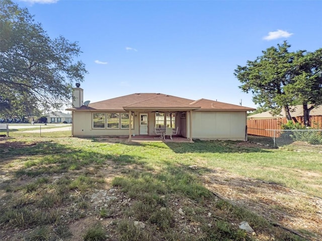 6005 La Mesa St, Leander, TX 78645 - back of property with a chimney and a patio area