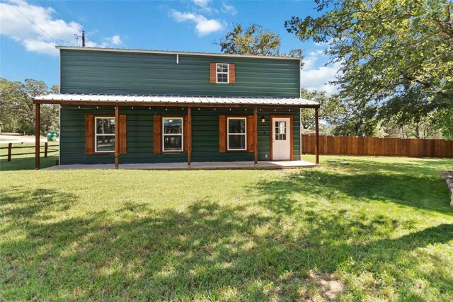 106 Harper Dr, Bastrop, TX 78602 - back of house with a patio area