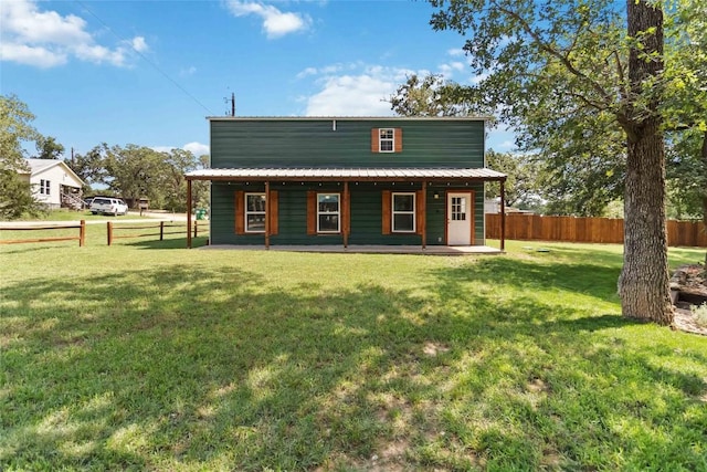 106 Harper Dr, Bastrop, TX 78602 - back of house with a metal roof