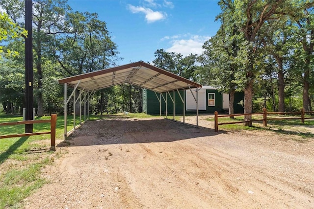 106 Harper Dr, Bastrop, TX 78602 - view of car parking featuring driveway and a detached carport