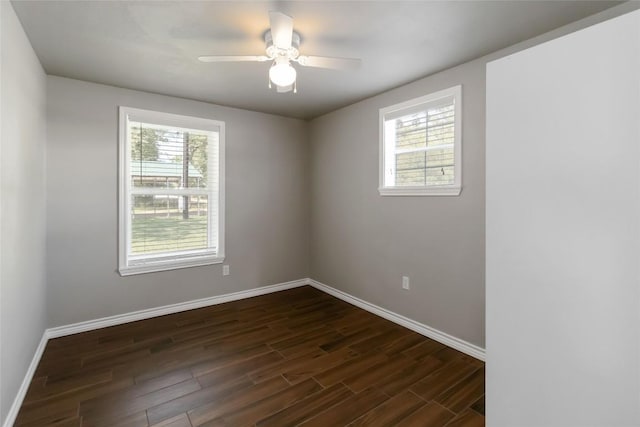 106 Harper Dr, Bastrop, TX 78602 - spare room with healthy amount of natural light, dark wood-type flooring, and a ceiling fan