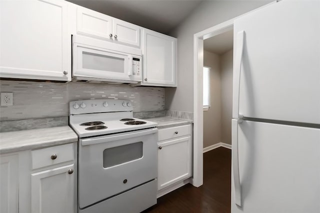 106 Harper Dr, Bastrop, TX 78602 - kitchen with white appliances, decorative backsplash, light countertops, and white cabinets