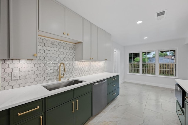 8909 Laurel Grove Dr, Austin, TX 78758 - kitchen featuring green cabinetry, stainless steel dishwasher, light countertops, light marble finish floors, and recessed lighting