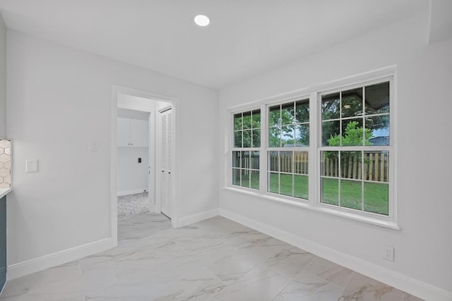 8909 Laurel Grove Dr, Austin, TX 78758 - unfurnished room with light marble finish flooring and recessed lighting