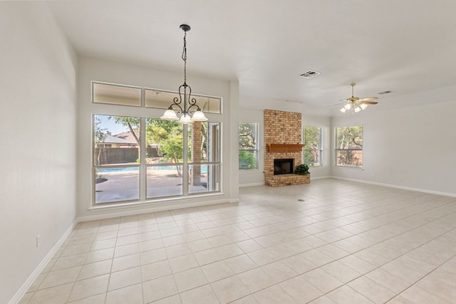 2700 Dagama Ct, Cedar Park, TX 78613 - unfurnished living room with a chandelier, light tile patterned flooring, a brick fireplace, and ceiling fan