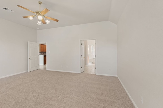 2700 Dagama Ct, Cedar Park, TX 78613 - unfurnished bedroom featuring light colored carpet, lofted ceiling, a ceiling fan, and connected bathroom