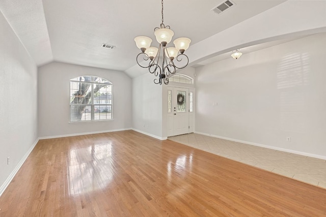 2700 Dagama Ct, Cedar Park, TX 78613 - unfurnished dining area with healthy amount of natural light, a chandelier, wood finished floors, and vaulted ceiling