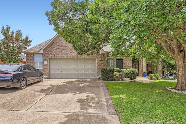 4231 N Summercrest Loop, Round Rock, TX 78681 - view of property hidden behind natural elements with an attached garage, driveway, a front lawn, brick siding, and a shingled roof