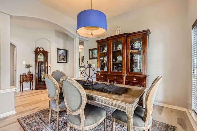 4231 N Summercrest Loop, Round Rock, TX 78681 - dining room with arched walkways and light wood-type flooring