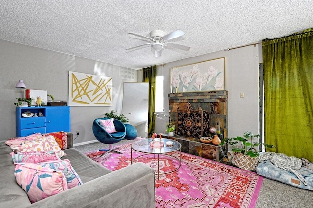 7825 Beauregard Cir Unit 26, Austin, TX 78745 - carpeted living area featuring ceiling fan, a textured ceiling, and a stone fireplace