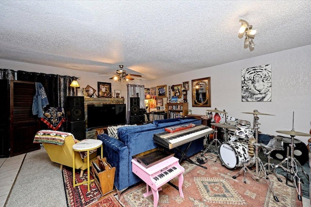 7825 Beauregard Cir Unit 26, Austin, TX 78745 - living room featuring a textured ceiling and ceiling fan