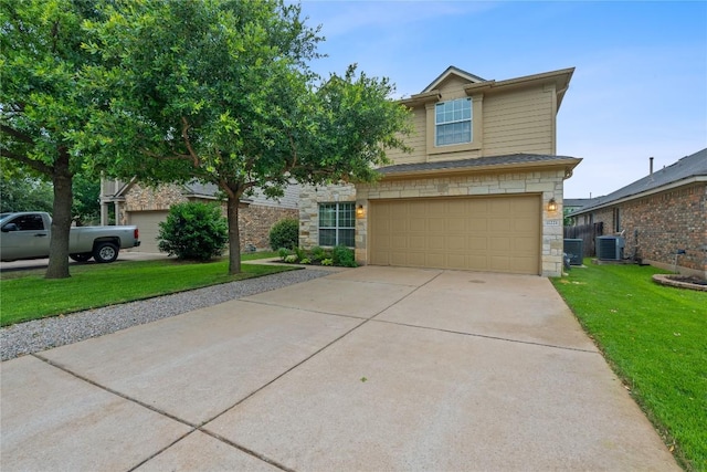 11221 Old Quarry Rd, Austin, TX 78717 - view of front of property featuring a front lawn, an attached garage, stone siding, and concrete driveway