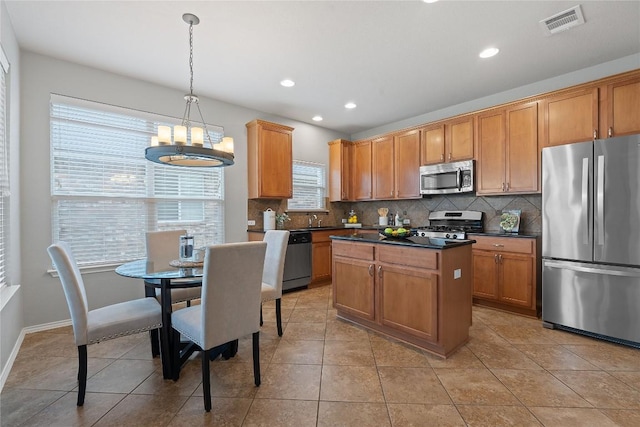 11221 Old Quarry Rd, Austin, TX 78717 - kitchen featuring appliances with stainless steel finishes, dark countertops, tasteful backsplash, plenty of natural light, and recessed lighting