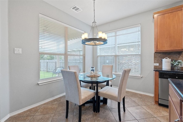 11221 Old Quarry Rd, Austin, TX 78717 - dining area with a chandelier, healthy amount of natural light, and light tile patterned floors