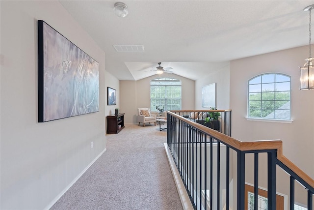 11221 Old Quarry Rd, Austin, TX 78717 - hall featuring vaulted ceiling, carpet flooring, an upstairs landing, and a chandelier