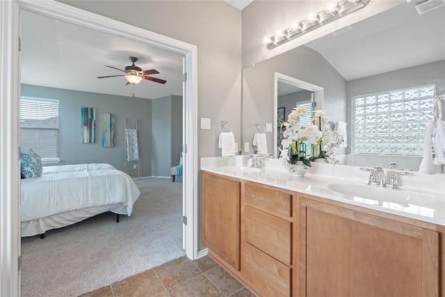 11221 Old Quarry Rd, Austin, TX 78717 - ensuite bathroom with double vanity, ceiling fan, a tub, and tile patterned floors