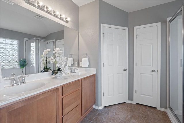11221 Old Quarry Rd, Austin, TX 78717 - full bath featuring double vanity, a stall shower, tile patterned flooring, and a closet