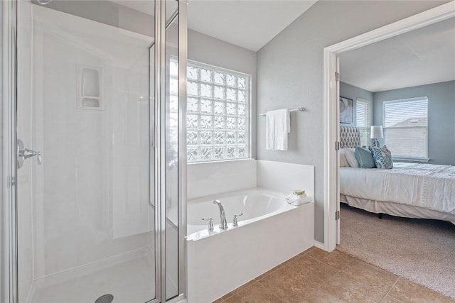 11221 Old Quarry Rd, Austin, TX 78717 - ensuite bathroom featuring a stall shower, a bath, and tile patterned floors