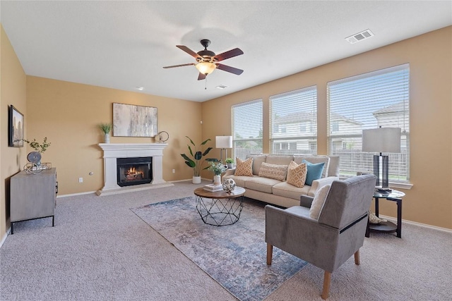 11221 Old Quarry Rd, Austin, TX 78717 - living room with carpet flooring, ceiling fan, and a glass covered fireplace