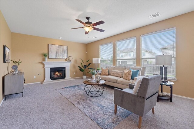 11221 Old Quarry Rd, Austin, TX 78717 - carpeted living room with a ceiling fan and a glass covered fireplace