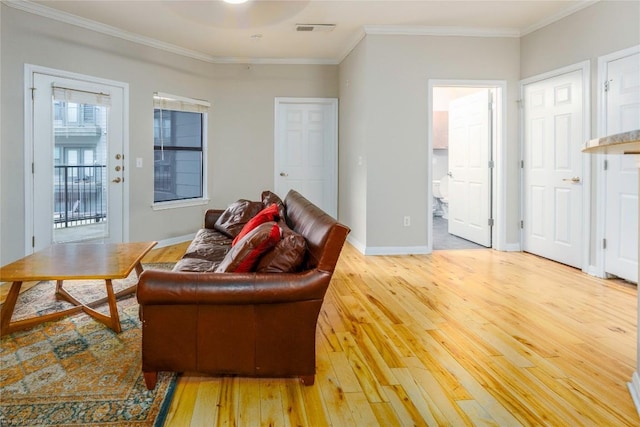 2502 Leon St Unit 305, Austin, TX 78705 - living room with light wood-style flooring and crown molding