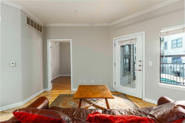 2502 Leon St Unit 305, Austin, TX 78705 - living room with plenty of natural light, ornamental molding, and wood finished floors