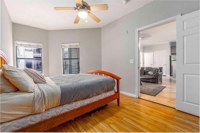 2502 Leon St Unit 305, Austin, TX 78705 - bedroom featuring light wood-type flooring and a ceiling fan