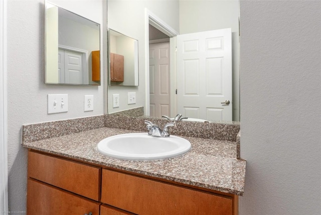 2502 Leon St Unit 305, Austin, TX 78705 - bathroom featuring vanity and a textured wall