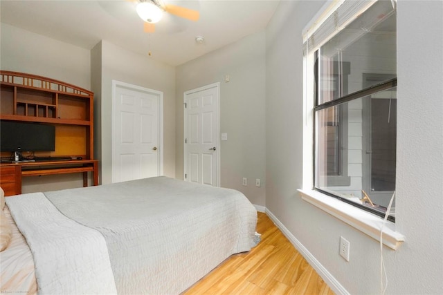 2502 Leon St Unit 305, Austin, TX 78705 - bedroom featuring light wood-style floors and baseboards