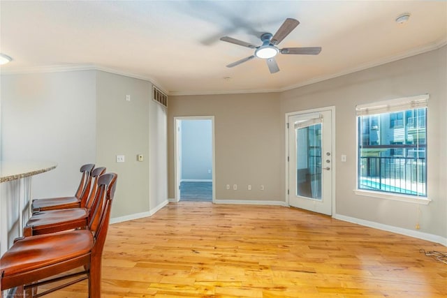 2502 Leon St Unit 305, Austin, TX 78705 - spare room with light wood-style flooring, ceiling fan, ornamental molding, and a smoke detector