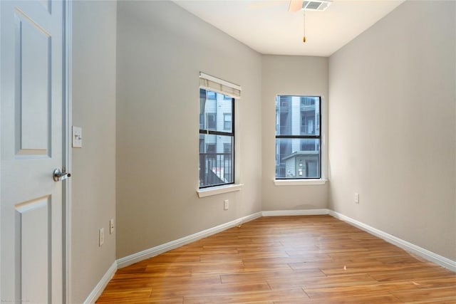 2502 Leon St Unit 305, Austin, TX 78705 - unfurnished room with light wood-type flooring and baseboards