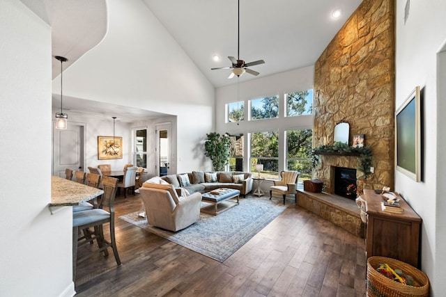 174 Jayne Cv, Austin, TX 78737 - living area featuring ceiling fan, a stone fireplace, high vaulted ceiling, dark wood finished floors, and recessed lighting