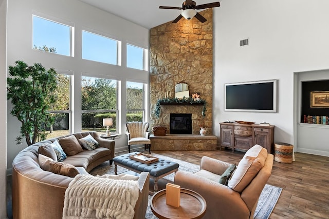 174 Jayne Cv, Austin, TX 78737 - living area with high vaulted ceiling, a ceiling fan, wood finished floors, and a fireplace