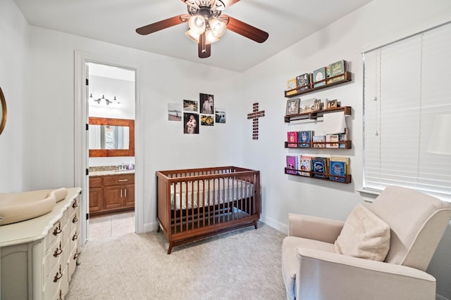 174 Jayne Cv, Austin, TX 78737 - bedroom with light carpet, a crib, a closet, ensuite bathroom, and ceiling fan