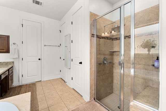 174 Jayne Cv, Austin, TX 78737 - bathroom featuring vanity, a shower stall, and tile patterned flooring
