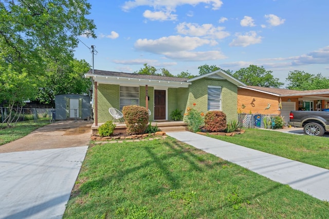 932 E 53 1/2 St, Austin, TX 78751 - view of front facade featuring driveway, a porch, and brick siding