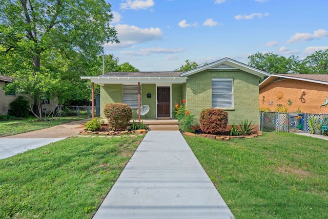 932 E 53 1/2 St, Austin, TX 78751 - view of front of property with brick siding, covered porch, and concrete driveway