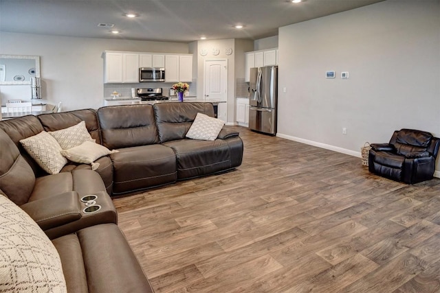 508 Bluffview Dr, Bastrop, TX 78602 - living area featuring wood finished floors and recessed lighting