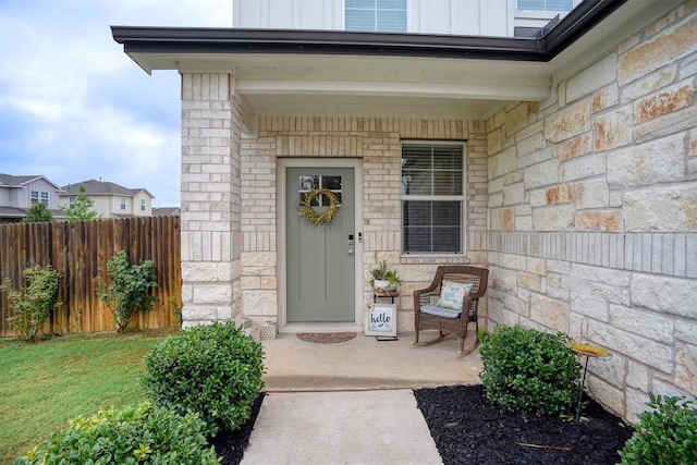 508 Bluffview Dr, Bastrop, TX 78602 - entrance to property featuring stone siding, board and batten siding, and a porch