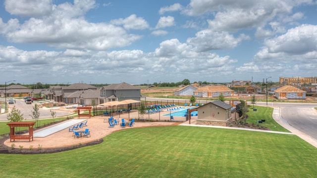 508 Bluffview Dr, Bastrop, TX 78602 - view of playground with a lawn and a residential view
