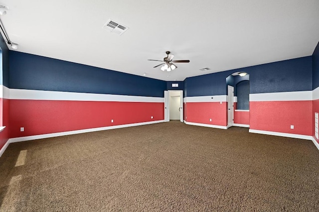 204 Lake Como Dr, Austin, TX 78734 - unfurnished room featuring a ceiling fan, dark colored carpet, and arched walkways