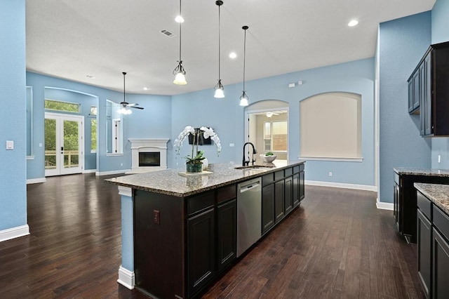 204 Lake Como Dr, Austin, TX 78734 - kitchen with stainless steel dishwasher, a ceiling fan, arched walkways, dark wood-style flooring, and recessed lighting