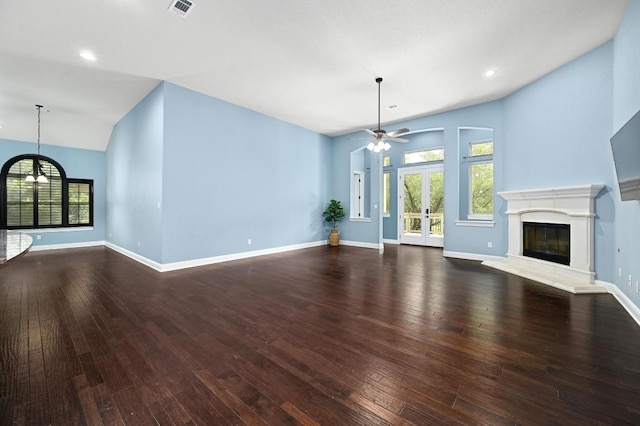 204 Lake Como Dr, Austin, TX 78734 - unfurnished living room with ceiling fan, plenty of natural light, hardwood / wood-style flooring, lofted ceiling, and recessed lighting