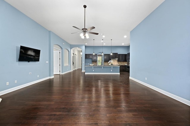 204 Lake Como Dr, Austin, TX 78734 - unfurnished living room with a ceiling fan, dark wood-type flooring, arched walkways, and recessed lighting